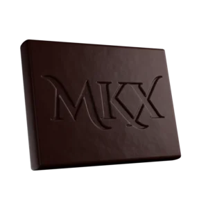 A milk chocolate THC bar with segmented pieces and a caramel swirl, featuring a simple label showing the product name and dosage from the MKX edibles brand.